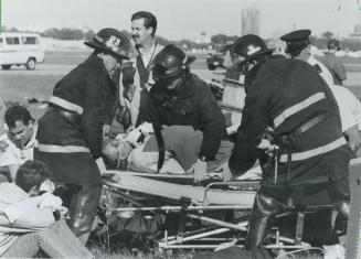 Just testing. Fire and ambulance crews attend to victims yesterday after a mock plane crash at the Toronto Island Airport