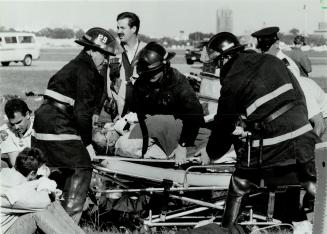 Just testing. Fire and ambulance crews attend to victims yesterday after a mock plane crash at the Toronto Island Airport