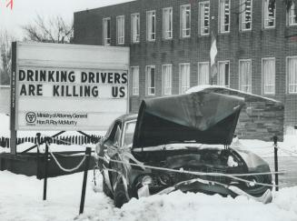 Wrecked car placed outside North York municipal offices in Attorney General Roy McMurtry's campaign against drinking drivers is all right, but the sig(...)