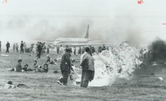 This scene of a simulated air disaster at Toronto International Airport with 250 victims looked so real that passengers flying overhead had to be assu(...)