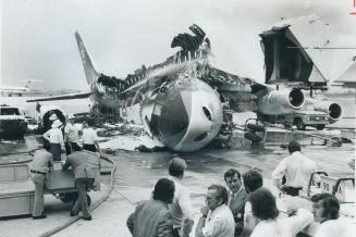 Charred wreckage is all that remains of an Air Canada DC-8 that exploded and burned at Toronto International Airport last night only six minute before(...)