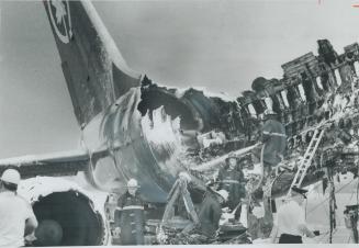 Flames destroyed the passenger section of an Air Canada DC-8 on the tarmac, then reached the tail