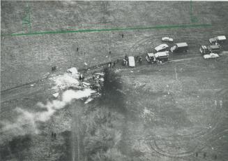 Aerial view shows rescue trucks surrounding the smashed plane in Beechwood Cemetery