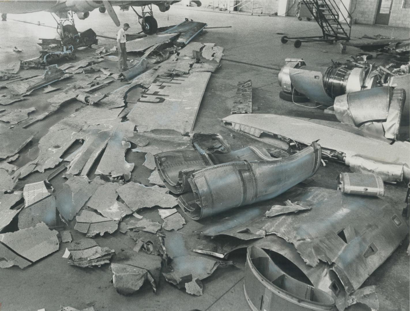 Reassembled wreckage of the crashed jet is spread out in a government hanger at Toronto International Airport in an attempt to find out why part of th(...)