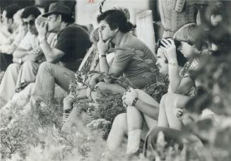 Friends and relatives of crash victims watch the search