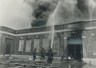 Visible for miles, smoke rises from the blaze that gutted York borough s Roseland Public School today as firemen train their hoses on the roof. The 50(...)