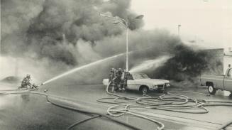 Employees escape unharmed in gas station fire