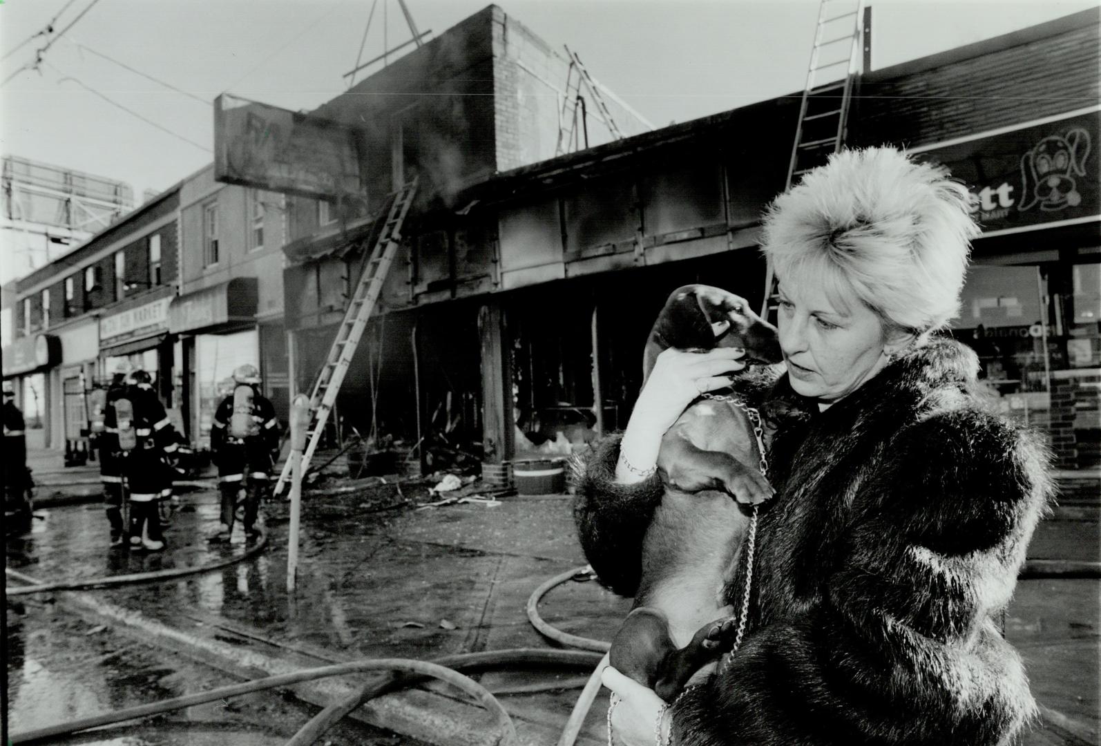 Little Hero: Jennifer Zilberleib says her dachshund's barking went a long way toward ensuring she and three children escaped the fire that gutted an auto body shop beneath their apartment yesterday