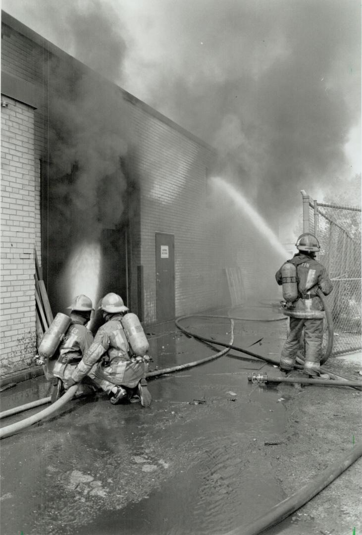 Factory Fire. Etobicoke firefighters battle a two-alarm blaze that caused $300.000 damage to a plant in the North Queen St. and Islington Ave. area yesterday