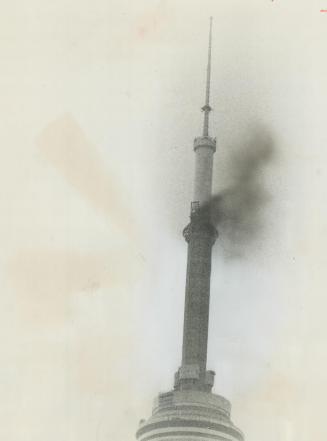 Fire on the CN Tower. Fire broke out at CN Tower about 2 p.m. today, above observation level, about 1,500 ft. up the 1,815-ft. tower. Thick smoke pour(...)