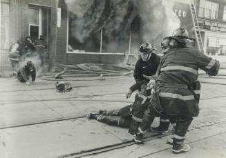 Brush with death. With flames licking at their backs and toxic black smoke belching around them, firemen fled and were pulled from a Parliament St. bu(...)