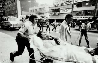 Firefighter overcome by smoke is rushed from scene of the fire