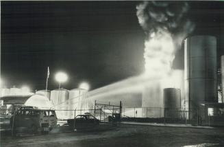 Fatal blast: Flames shot 60 feet into the sky late last night after an explosion at McAsphalt Industries Ltd