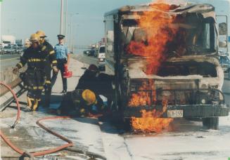 Van burns on the 401. Firefighters on Highway 401 near Dufferin St. hose down flames after a propane-fuelled van caught fire during the afternoon rush(...)