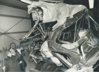 The mangled wreck of the Toronto Transit Commission bus that was hit by a GO train on St