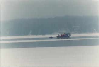 Divers search for snowmobiles Lake Scugog