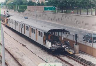 Subway Car that slammed into stationary train is moved to Wilson yard