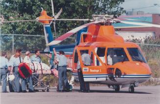 Blast victim: Agostinho Botelho of Brampton, suffering burns to 80 per cent of his body, is loaded on to an air ambulance