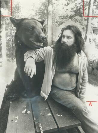 In calmer days, Smokey the Bear posed with his owner, David McKigney