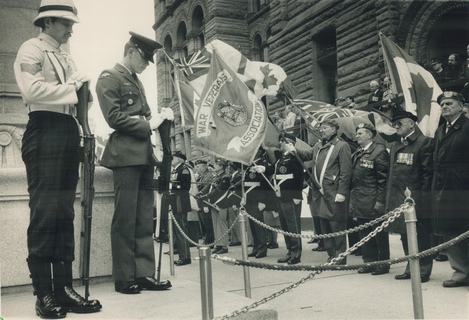 Their valor lives: Comrades who paid the surpeme sacrifice are honored by veteran in a Remembrance Day ceremony yesterday at the cenotaph at Toronto's old city hall