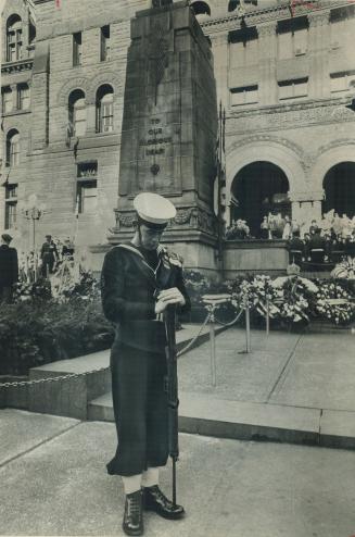 A lone sailor bows his head. And Toronto honors its dead of four wars