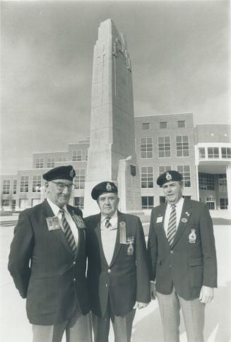 Standing on guard. Branch 15 Royal Canadian Legion members Jim Davidson, left, Reg Smith, middle, and Richard Felix prepare for Remembrance Day ceremo(...)