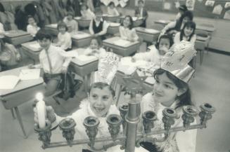Eight candles. Yontan Goldstein, 7, and Sarah Abrahamovitz, 7, of Netivot Hatorah Day School in North York, rehearse for a Chanukah play by lighting c(...)