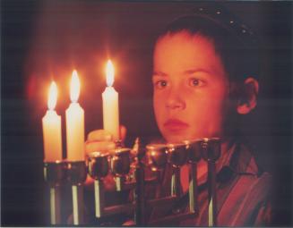 Come light the menorah. 7-year-old Mendy Yarmush, a Grade 3 student at Chabad Lubavitch School of Southern Ontario in Thornhill, lights the menorah fo(...)