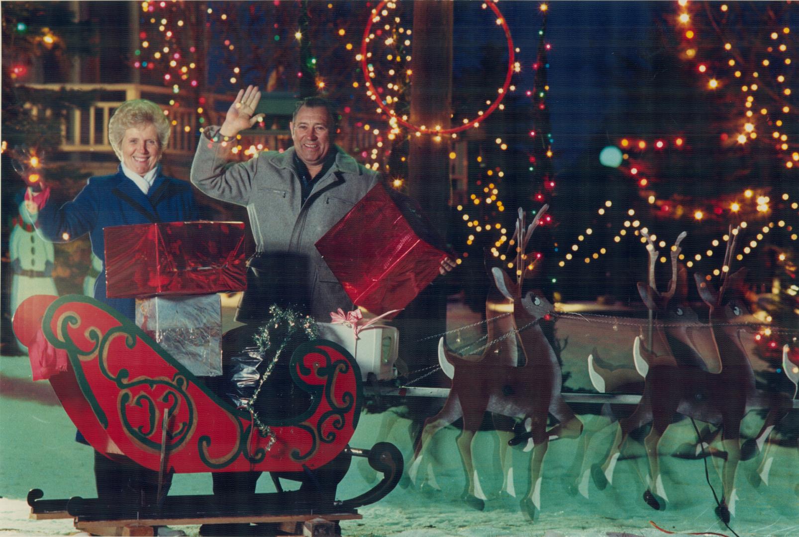 Christmas house of lights. Jack and Muriel Scott recently flipped the switch to light up Santa and his sleigh, eight reindeer, three carollers, a Nati(...)