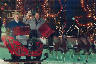Christmas house of lights. Jack and Muriel Scott recently flipped the switch to light up Santa and his sleigh, eight reindeer, three carollers, a Nati(...)