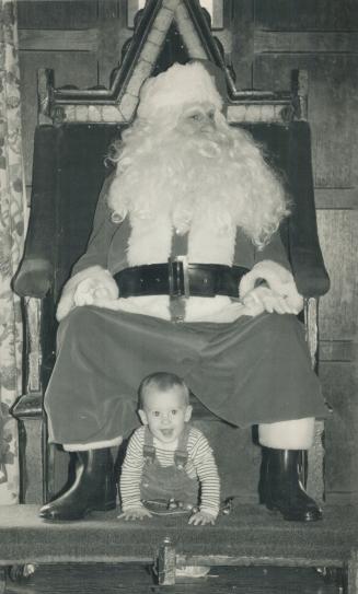 Claus has no effect. Little Clayton Tucker, 11 months, of Markham pays scant attention to Santa as he explores the Christmas terrain at Casa Loma yest(...)