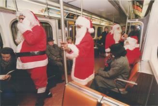 Four Santas head home after urging transit-users at five subway stations yesterday to donate to the Catholic Children's Aid Society. While reindeer we(...)