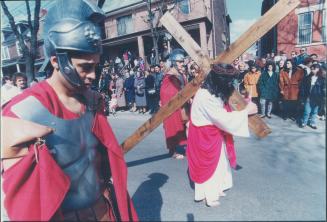 Guiseppe Ranti carries a cross