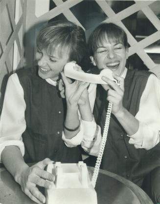 Happy Mother's Day. Annick and Nadia Torfs enjoy a long-distance call to their mom in Uxbridge, courtesy of the the Hudson's Bay Centre. Visitors are (...)