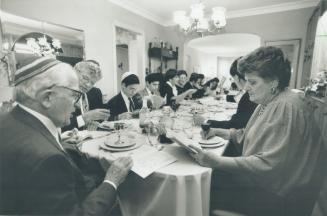 Hebrew ritual: Patriarch Julie Goodbaum, left, and wife Esther join 21 other members of the family in the songs and toasts preceding a Passover eve meal, which marks enslaved Jews' escape from Egypt