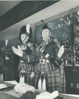 You deserve a McHaggis today. Sergeant Ken Wells (left) and warrant officer George Walker of The 48th Highlanders had their hands full yesterday when (...)