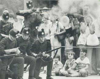 The Queen's Own Rifles stage a mock battle in Nathan Phillips Square to the delight of the kids