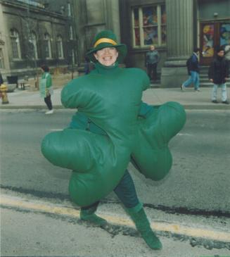 Wearing O' the green. A live shamrock strolls along Toronto streets yesterday during the city's St. Patrick's Day parade