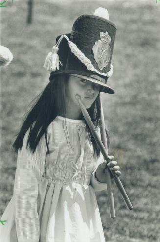 Little Drummer: Dressed in period costume, Keiko Twist, 7, seems lost in thought yesterday during festivities at Fort York