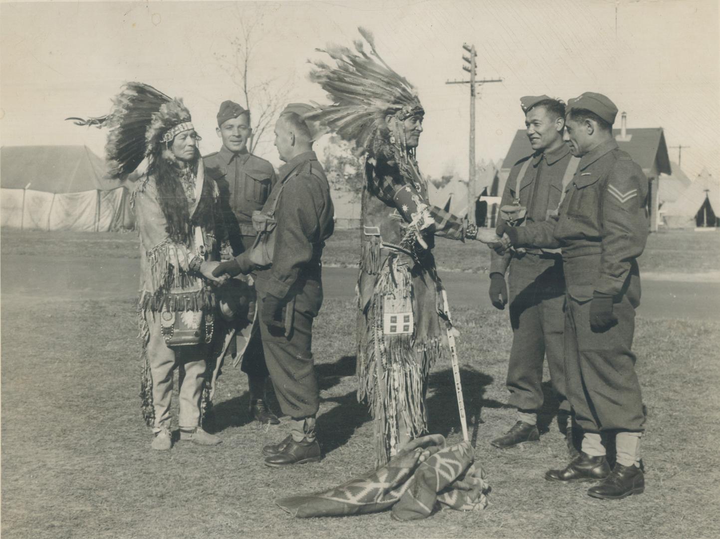 They're in the army now, but Indians of the Six Nations are still subject to patriarchal supervision of their tribal leaders. Here Chief Black Cloud a(...)