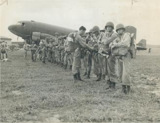 Twenty enlisted men and six officers of the first Canadian parachute battalion received their silver wings as qualified jumpers yesterday in a colorfu(...)