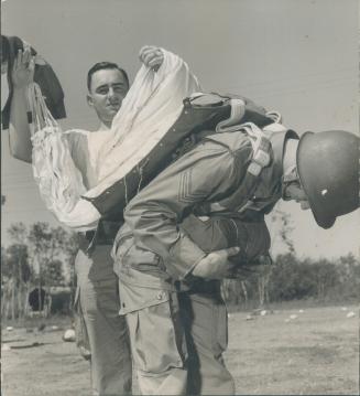3. Static line now is all out and parachute cover has been ripped off, showing the first opening of the chute. Early part of paratroopers training at (...)