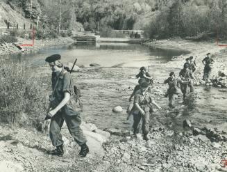 In full field equipment, female enrolees in the Canadian Forces undergo tough training