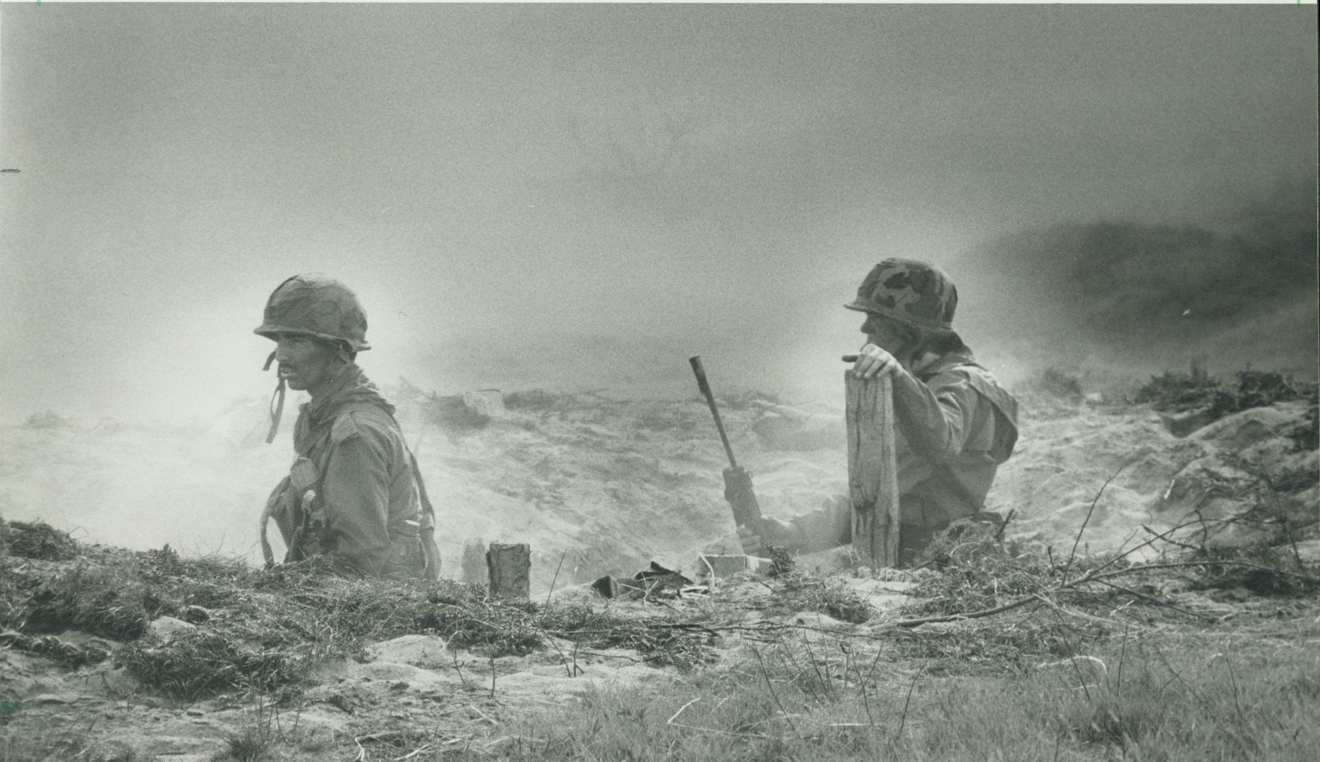A smokescreen keeps the young volunteer reservists in the trenches from seeing the approach of the 'enemy' in attacks that are as realistic as possible