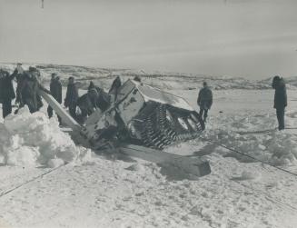 Within sight of Port Radium this Muskox expedition snowmobile crashed through a wide crack in the ice