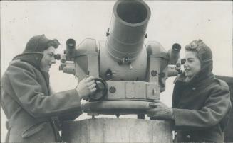 Girls behind the guns are playing a key part in the training of Britain's anti-aircraft gunners