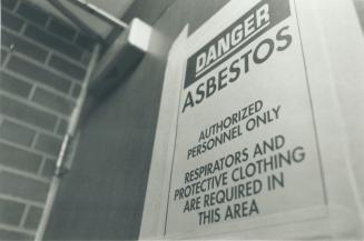 Grim story: Sign warns of danger after the auditorium and library at Humberside Collegiate Institute are closed for an indefinite period because of asbestos