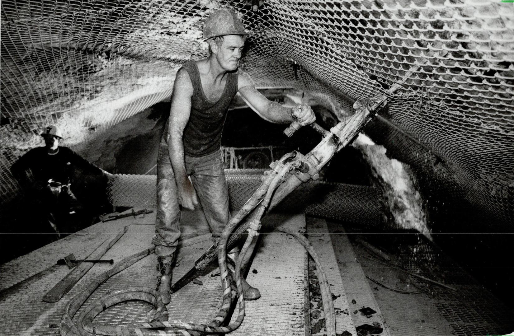 Below left, a worker drills rock-bolt holes in the intake tunnel, which will curve 1,000 metres under Lake Ontario