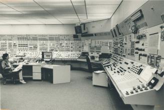Operator watches the extensive panel in the control room