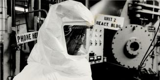 Radioactive workplace: Tradesmen looked like astronauts when they donned special suits to enter reactors where they replaced damaged fuel-carrying tubes